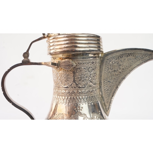 49 - A SILVER DALLAH COFFEE POT, PROBABLY EGYPT OR TUNISIA, EARLY 20TH CENTURY  Of typical form, with a b... 