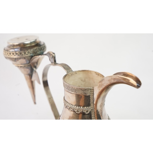 50 - A SILVER ARABIC COFFEE POT, MIDDLE EAST  Of traditional shape, a silver coffee pot with intricate de... 