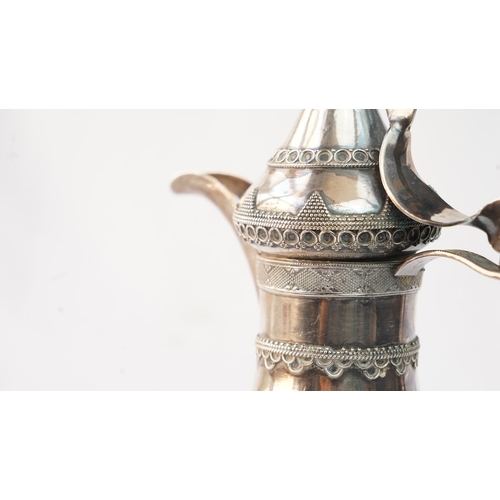 50 - A SILVER ARABIC COFFEE POT, MIDDLE EAST  Of traditional shape, a silver coffee pot with intricate de... 