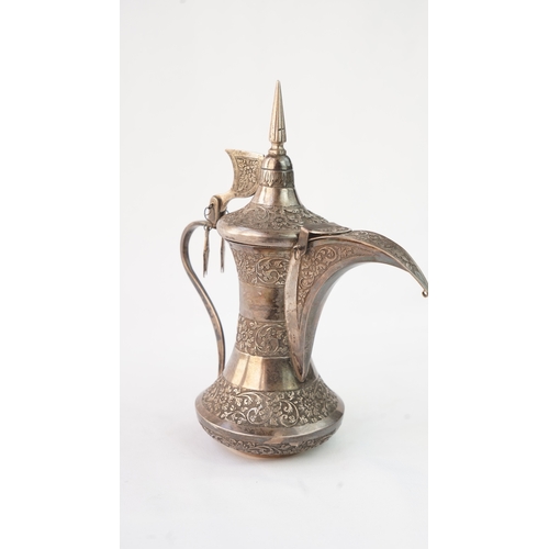 52 - A SILVER DALLAH COFFEE POT, MUSCAT, EARLY 20TH CENTURY. Of traditional shape, a silver coffee pot wi... 