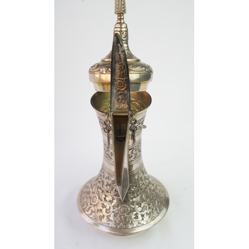 54 - A SILVER COFFEE POT (DALLAH), OMAN NIZWA, 1940-50  Of traditional shape, a silver coffee pot with fi... 