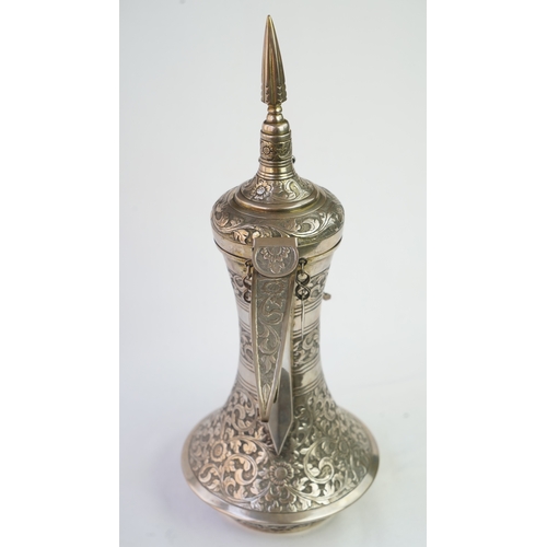 54 - A SILVER COFFEE POT (DALLAH), OMAN NIZWA, 1940-50  Of traditional shape, a silver coffee pot with fi... 