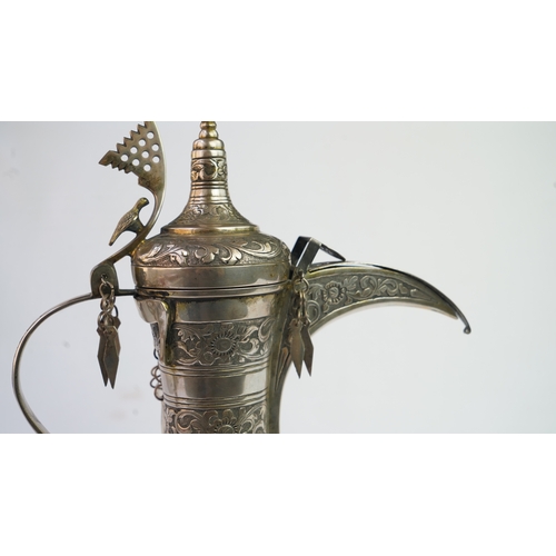 54 - A SILVER COFFEE POT (DALLAH), OMAN NIZWA, 1940-50  Of traditional shape, a silver coffee pot with fi... 