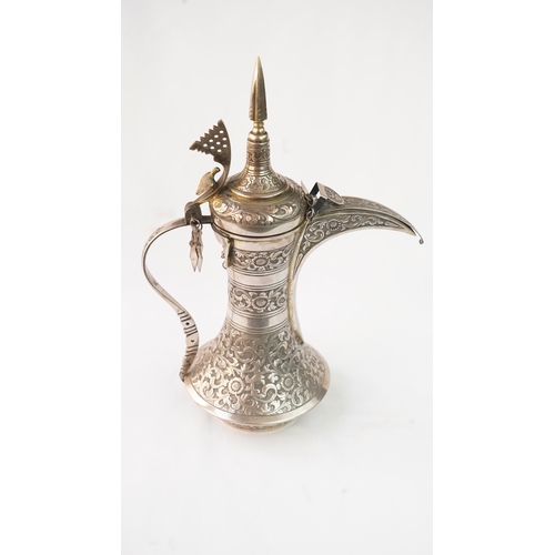 54 - A SILVER COFFEE POT (DALLAH), OMAN NIZWA, 1940-50  Of traditional shape, a silver coffee pot with fi... 