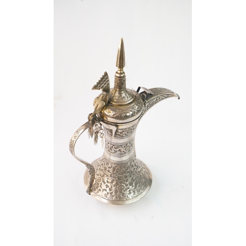 54 - A SILVER COFFEE POT (DALLAH), OMAN NIZWA, 1940-50  Of traditional shape, a silver coffee pot with fi... 