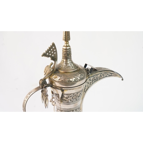 54 - A SILVER COFFEE POT (DALLAH), OMAN NIZWA, 1940-50  Of traditional shape, a silver coffee pot with fi... 