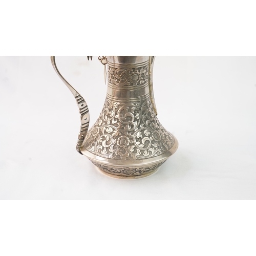 54 - A SILVER COFFEE POT (DALLAH), OMAN NIZWA, 1940-50  Of traditional shape, a silver coffee pot with fi... 