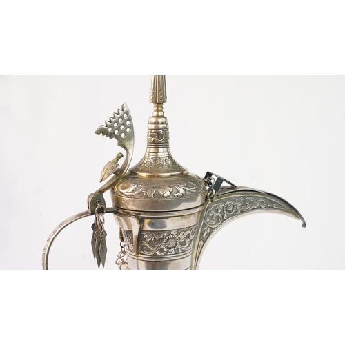 54 - A SILVER COFFEE POT (DALLAH), OMAN NIZWA, 1940-50  Of traditional shape, a silver coffee pot with fi... 