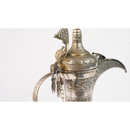 54 - A SILVER COFFEE POT (DALLAH), OMAN NIZWA, 1940-50  Of traditional shape, a silver coffee pot with fi... 