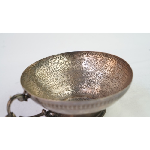 6 - A FINELY ENGRAVED SILVER CUP The interior profoundly engraved with a band of Arabic inscriptions, en... 