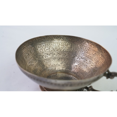 6 - A FINELY ENGRAVED SILVER CUP The interior profoundly engraved with a band of Arabic inscriptions, en... 