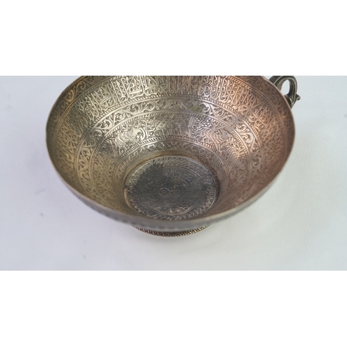 6 - A FINELY ENGRAVED SILVER CUP The interior profoundly engraved with a band of Arabic inscriptions, en... 