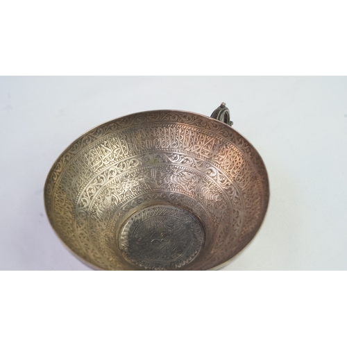 6 - A FINELY ENGRAVED SILVER CUP The interior profoundly engraved with a band of Arabic inscriptions, en... 