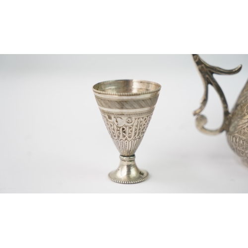 7 - FOUR EGYPTIAN SILVER COFFEE CUPS, OTTOMAN EMPIRE Of conical shape, rising from splayed foot, the ext... 