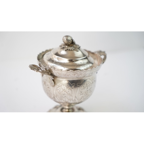 9 - A SILVER SUGAR BOWL WITH A LID Of circular form raised upon bracket feet, handles at both sides, the... 