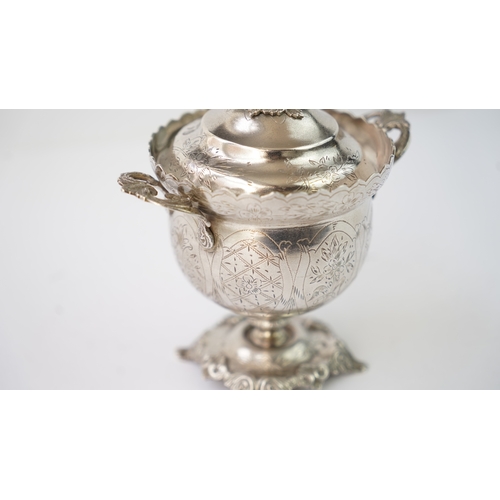 9 - A SILVER SUGAR BOWL WITH A LID Of circular form raised upon bracket feet, handles at both sides, the... 