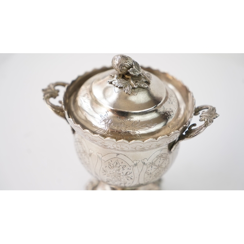 9 - A SILVER SUGAR BOWL WITH A LID Of circular form raised upon bracket feet, handles at both sides, the... 