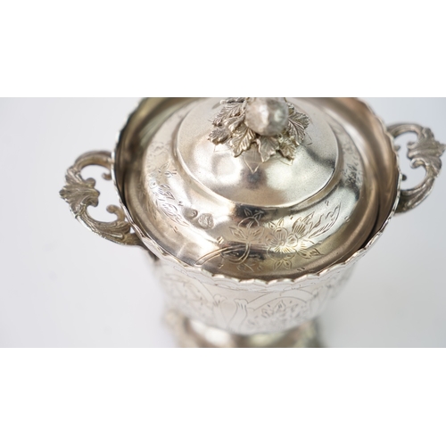 9 - A SILVER SUGAR BOWL WITH A LID Of circular form raised upon bracket feet, handles at both sides, the... 