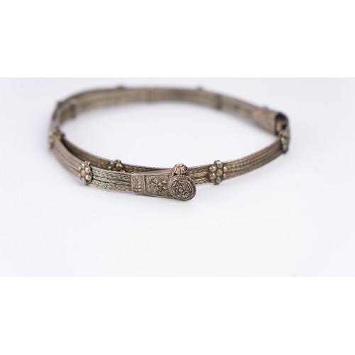 138 - A WOVEN SILVER INDIAN BELT,
Composed of multiple interwoven strands, each delicately joined with sil... 