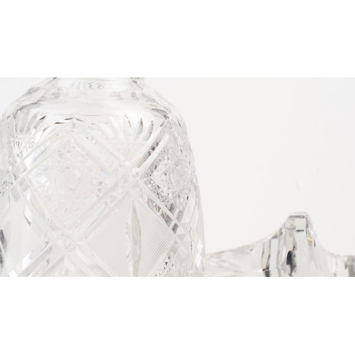 140 - AN ELEGANT CRYSTAL DECANTER AND ITS STOPPER,The decanter of rounded form, the faceted face accented ... 