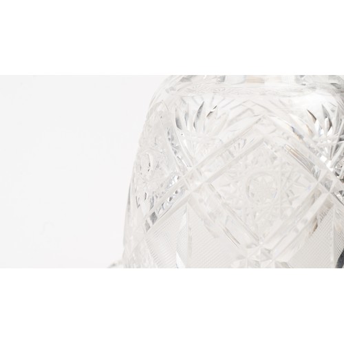 140 - AN ELEGANT CRYSTAL DECANTER AND ITS STOPPER,The decanter of rounded form, the faceted face accented ... 