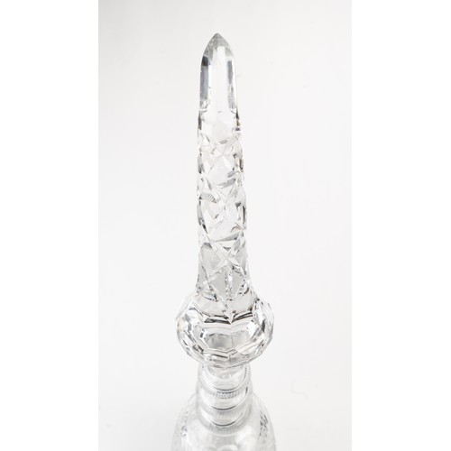 140 - AN ELEGANT CRYSTAL DECANTER AND ITS STOPPER,The decanter of rounded form, the faceted face accented ... 