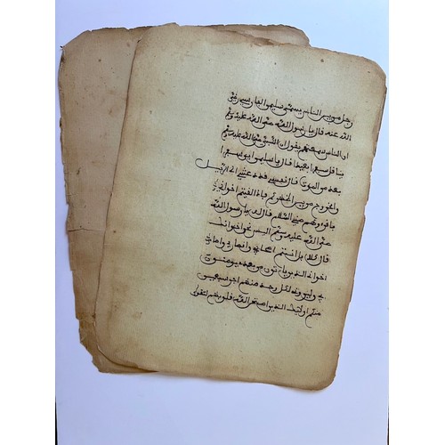 134 - TWO FOLIOS FROM A MAGHRIB QUR’ANIC MANUSCRIPT
Arabic manuscript on paper, 12 lines of dark sepia mag... 