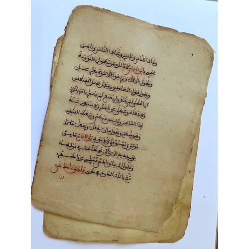 134 - TWO FOLIOS FROM A MAGHRIB QUR’ANIC MANUSCRIPT
Arabic manuscript on paper, 12 lines of dark sepia mag... 