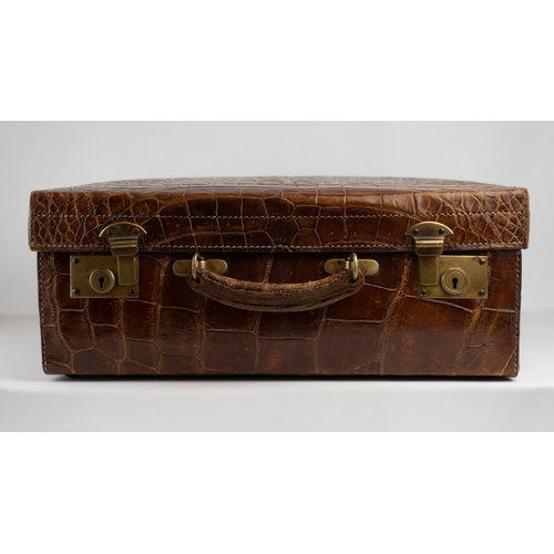 1 - A FINE 
LEATHER CROCODILE-EMBOSSED CASE BY BAKERS KENSINGTON, EARLY 20TH CENTURY.Crafted by the este... 