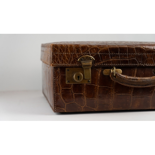 1 - A FINE 
LEATHER CROCODILE-EMBOSSED CASE BY BAKERS KENSINGTON, EARLY 20TH CENTURY.Crafted by the este... 