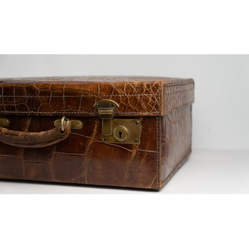 1 - A FINE 
LEATHER CROCODILE-EMBOSSED CASE BY BAKERS KENSINGTON, EARLY 20TH CENTURY.Crafted by the este... 