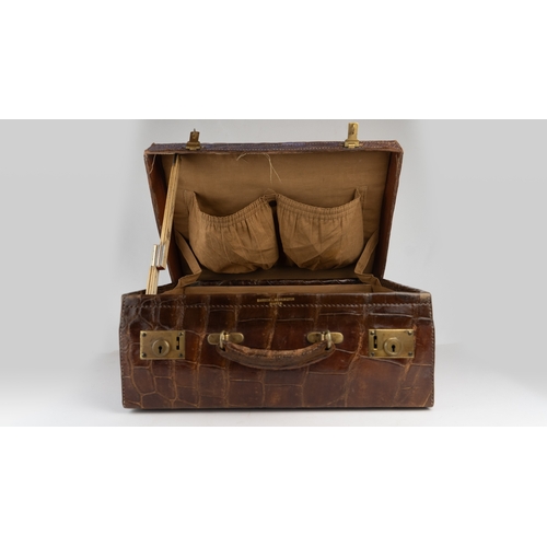 1 - A FINE 
LEATHER CROCODILE-EMBOSSED CASE BY BAKERS KENSINGTON, EARLY 20TH CENTURY.Crafted by the este... 