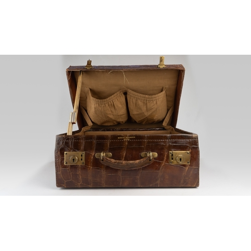 1 - A FINE 
LEATHER CROCODILE-EMBOSSED CASE BY BAKERS KENSINGTON, EARLY 20TH CENTURY.Crafted by the este... 