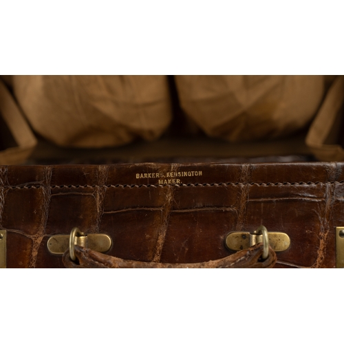 1 - A FINE 
LEATHER CROCODILE-EMBOSSED CASE BY BAKERS KENSINGTON, EARLY 20TH CENTURY.Crafted by the este... 