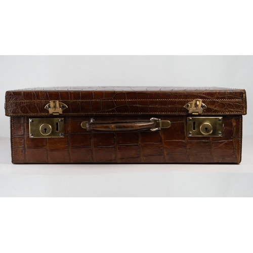 2 - A FINE CROCODILE LEATHER TRAVEL CASE.Of rectangular form, a travel case featuring a rich crocodile s... 