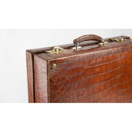 2 - A FINE CROCODILE LEATHER TRAVEL CASE.Of rectangular form, a travel case featuring a rich crocodile s... 