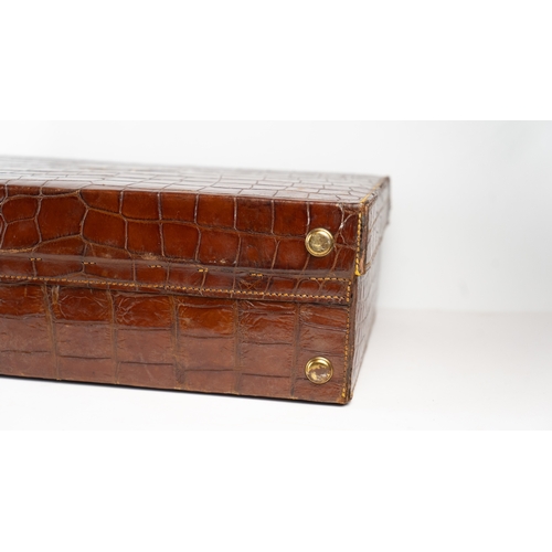 2 - A FINE CROCODILE LEATHER TRAVEL CASE.Of rectangular form, a travel case featuring a rich crocodile s... 