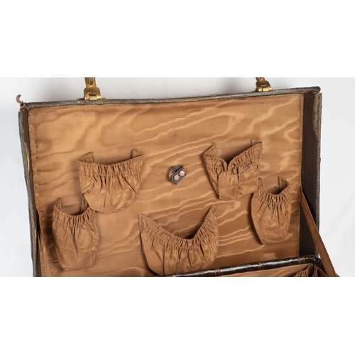 3 - AN EARLY 
20TH CENTURY DARK BROWN CROCODILE LEATHER SUITCASE.Of rectangular form, a travel case feat... 