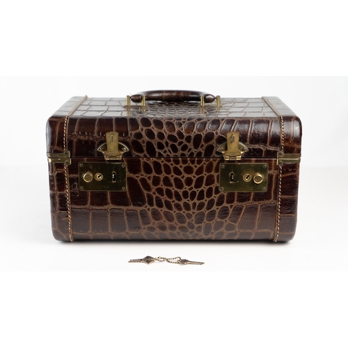 4 - A FINE ALLIGATOR OR CROCODILE LEATHER TRAVEL CASE, EARLY 20TH CENTURY.Of rectangular form, a meticul... 