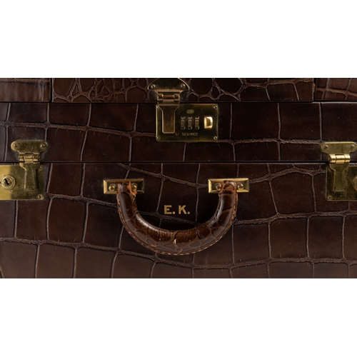 6 - A CROCODILE LEATHER TRAVEL AND VANITY CASE,              
Of rectangular form, formed of two layers,... 