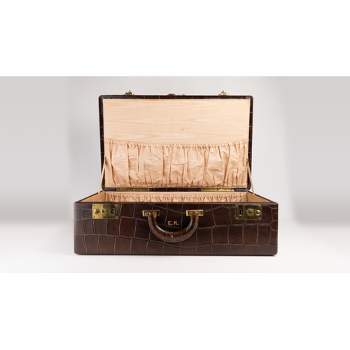 6 - A CROCODILE LEATHER TRAVEL AND VANITY CASE,              
Of rectangular form, formed of two layers,... 