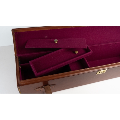 10 - A LEATHER DOUBLE MOTOR GUNCASE.Of rectangular form, fitted for 28in. barrels (could be adapted to 31... 