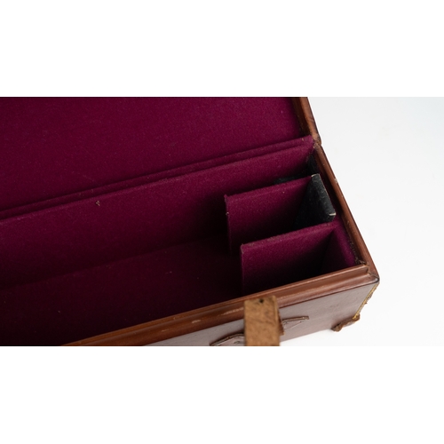 10 - A LEATHER DOUBLE MOTOR GUNCASE.Of rectangular form, fitted for 28in. barrels (could be adapted to 31... 