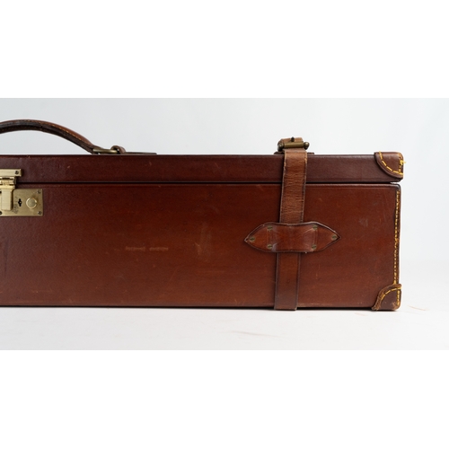 10 - A LEATHER DOUBLE MOTOR GUNCASE.Of rectangular form, fitted for 28in. barrels (could be adapted to 31... 