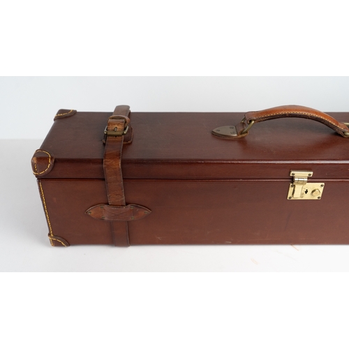 10 - A LEATHER DOUBLE MOTOR GUNCASE.Of rectangular form, fitted for 28in. barrels (could be adapted to 31... 