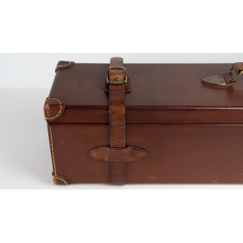 10 - A LEATHER DOUBLE MOTOR GUNCASE.Of rectangular form, fitted for 28in. barrels (could be adapted to 31... 