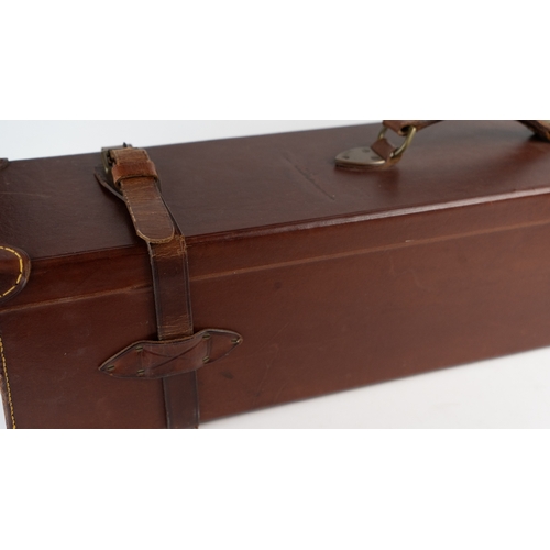 10 - A LEATHER DOUBLE MOTOR GUNCASE.Of rectangular form, fitted for 28in. barrels (could be adapted to 31... 