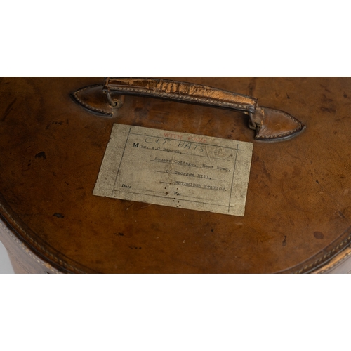 11 - A VINTAGE LEATHER HAT BOX, mid 20th Century.Of cylindrical form, a leather hat box in rich brown hue... 