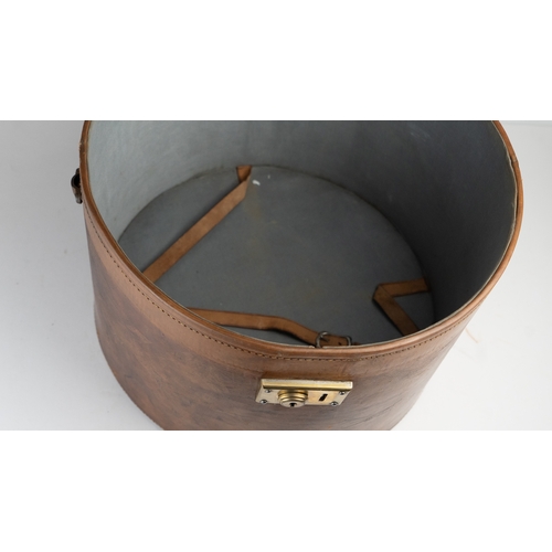 11 - A VINTAGE LEATHER HAT BOX, mid 20th Century.Of cylindrical form, a leather hat box in rich brown hue... 