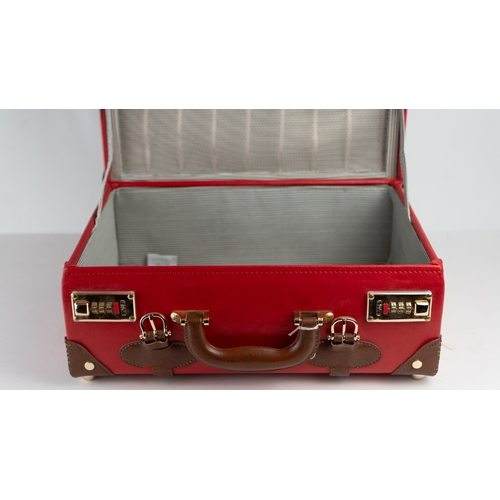 12 - THE ENTREPRENEUR, OVERNIGHTER, by STEAMLINE LUGGAGE.Of rectangular form, featuring red vegan leather... 